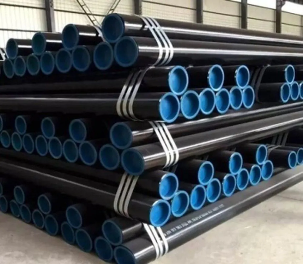 Black carbon steel pipes with blue end caps, stacked in bundles
